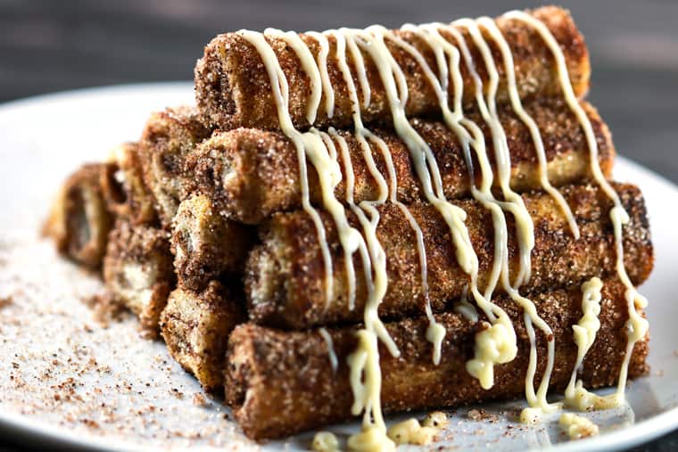 Easy Cinnamon Roll French Toast Rolls Ups - These easy cinnamon roll french toast roll ups will satisfy your cravings in a jiffy! These are perfect for breakfast, but hey, we can have them all day! | ScrambledChefs.com