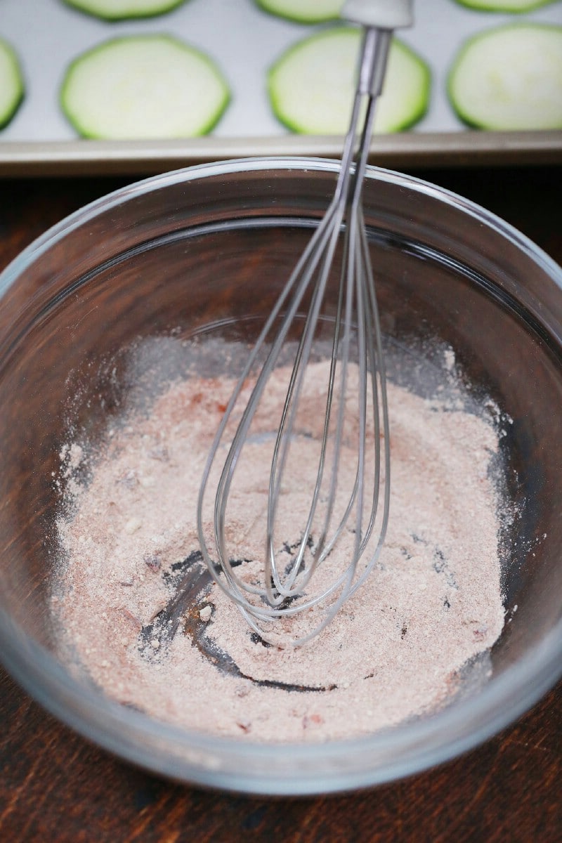 Whisking seasoning in stainless steel bowl