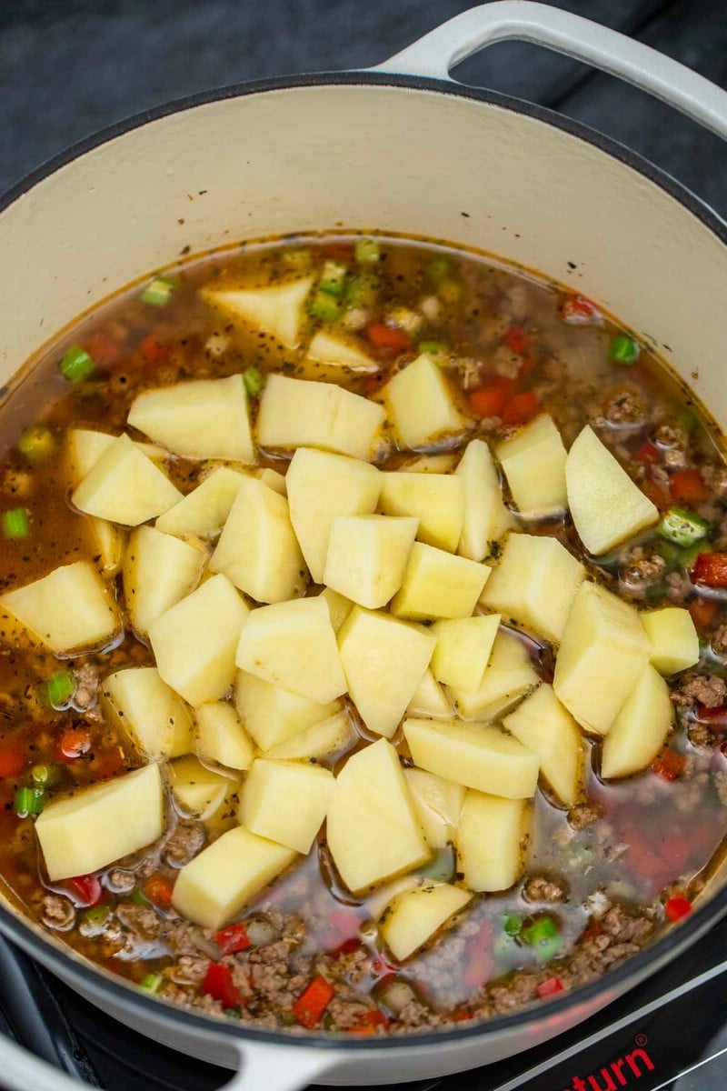 Adding potatoes to cheeseburger soup