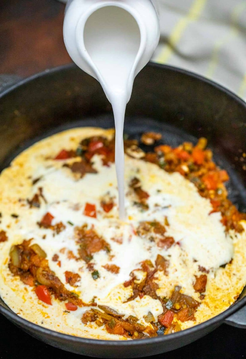 Pouring milk into cast iron skillet