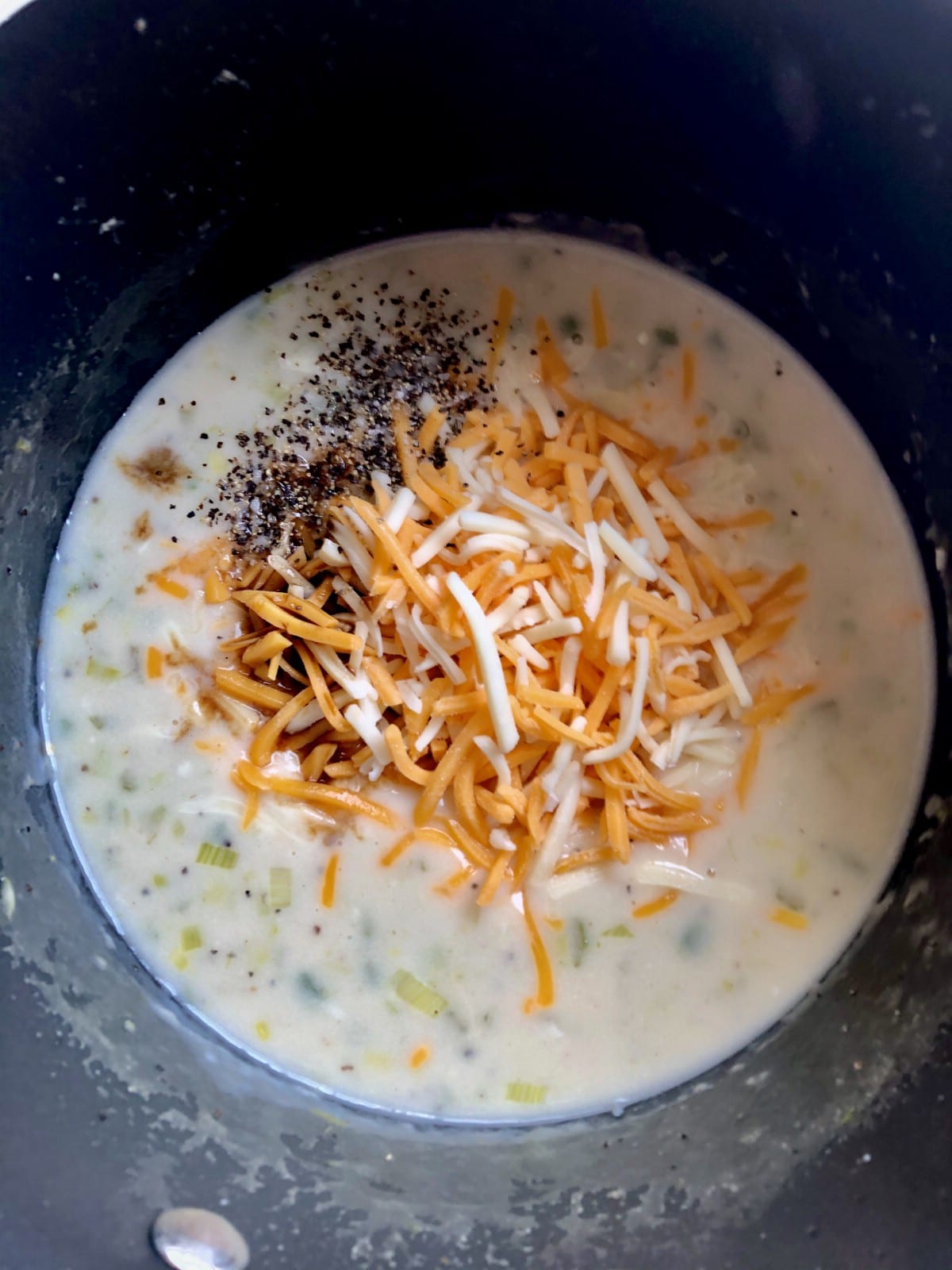 Adding cheese to soup