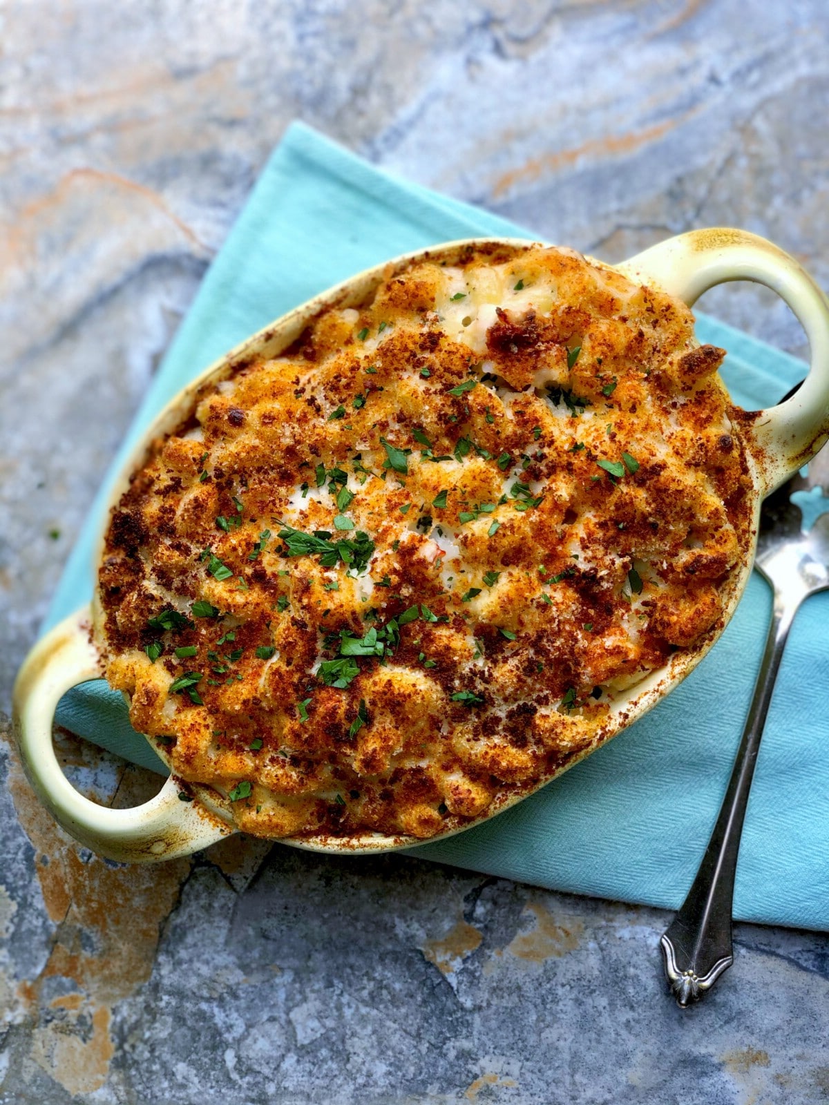 Baking dish filled with lobster mac and cheese