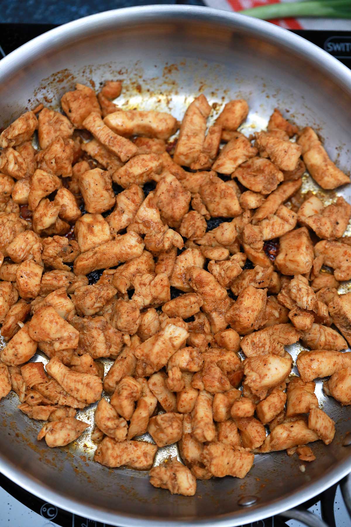 Chicken cooking in skillet