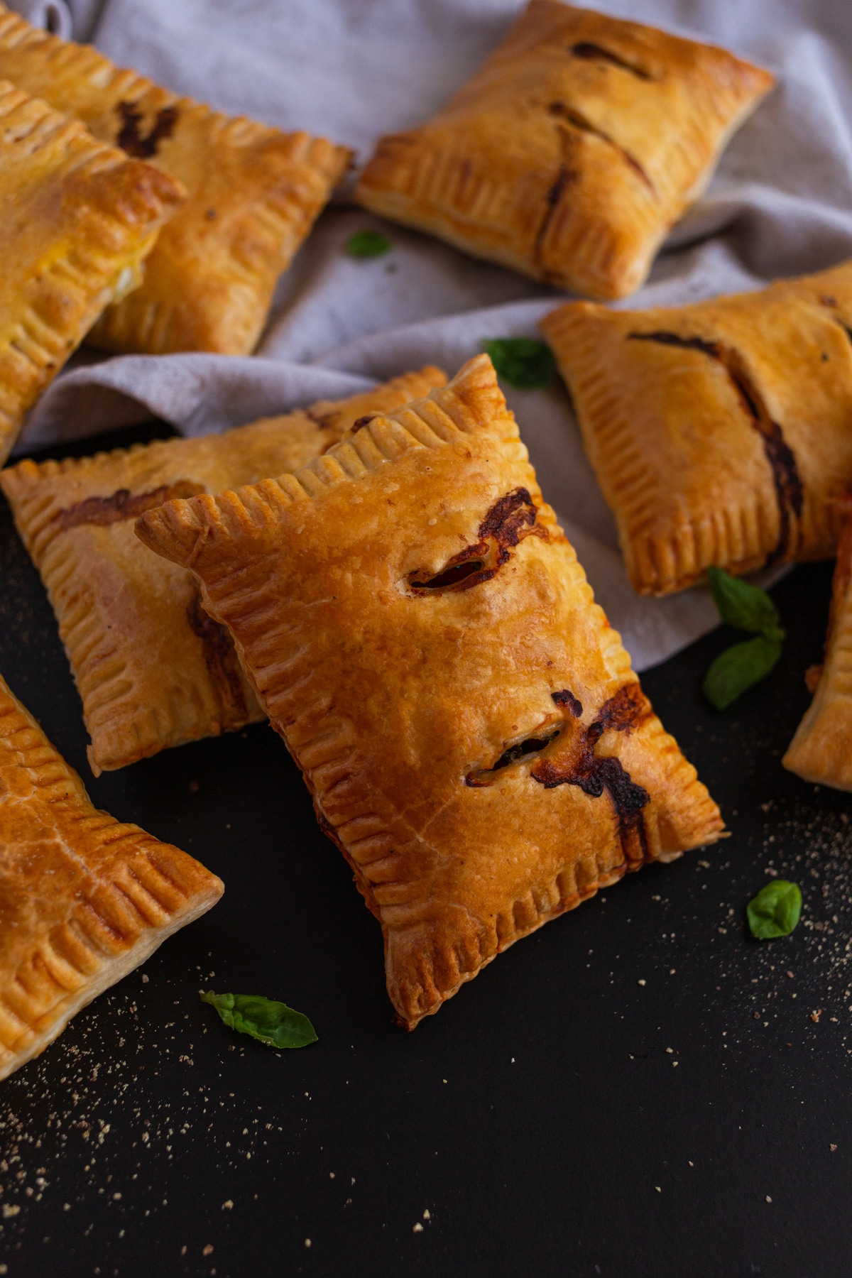 Pizza puffs on black surface