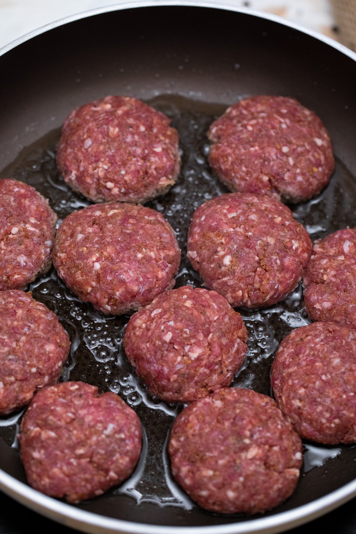 Hamburger patties in skillet