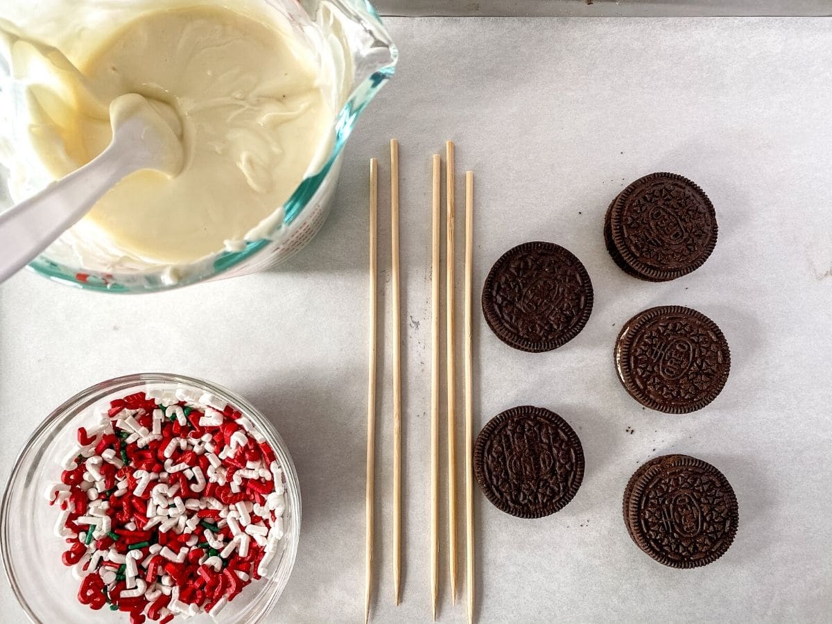Oreos on trays with melted chocolate
