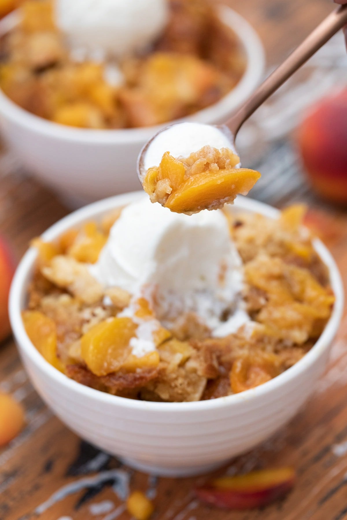 Spoon of cobbler with ice cream