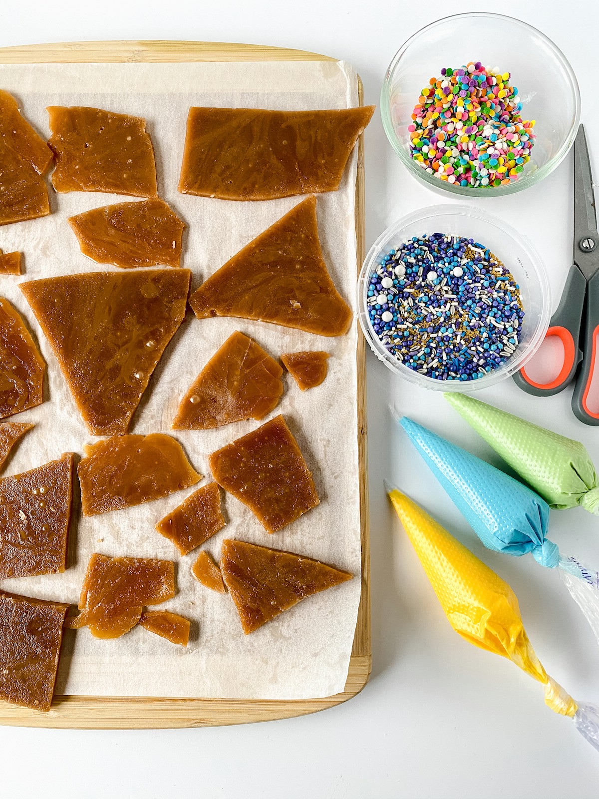 Toff on baking sheet with chocolate melts beside and sprinkles
