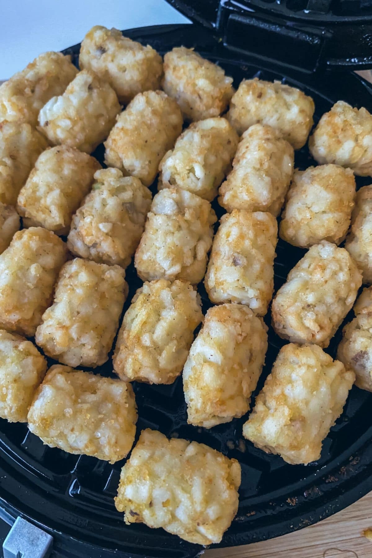 Tater tots on waffle iron
