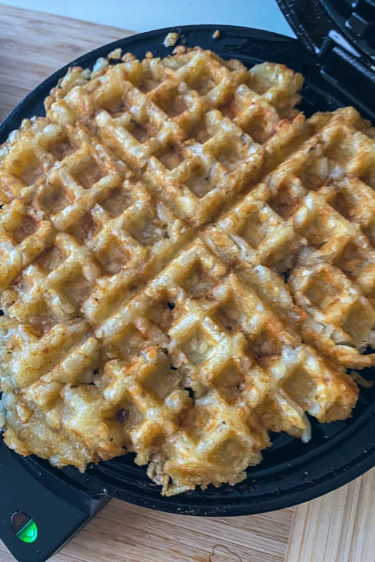 Tater tot waffle in waffle iron