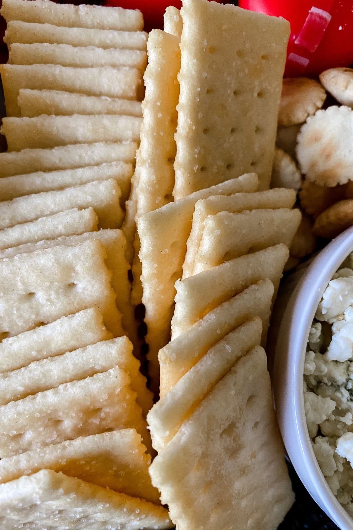 Club crackers on platter by ramekin