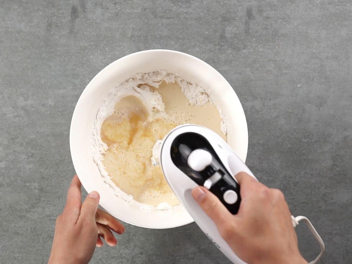 Beating pie filling in white bowl