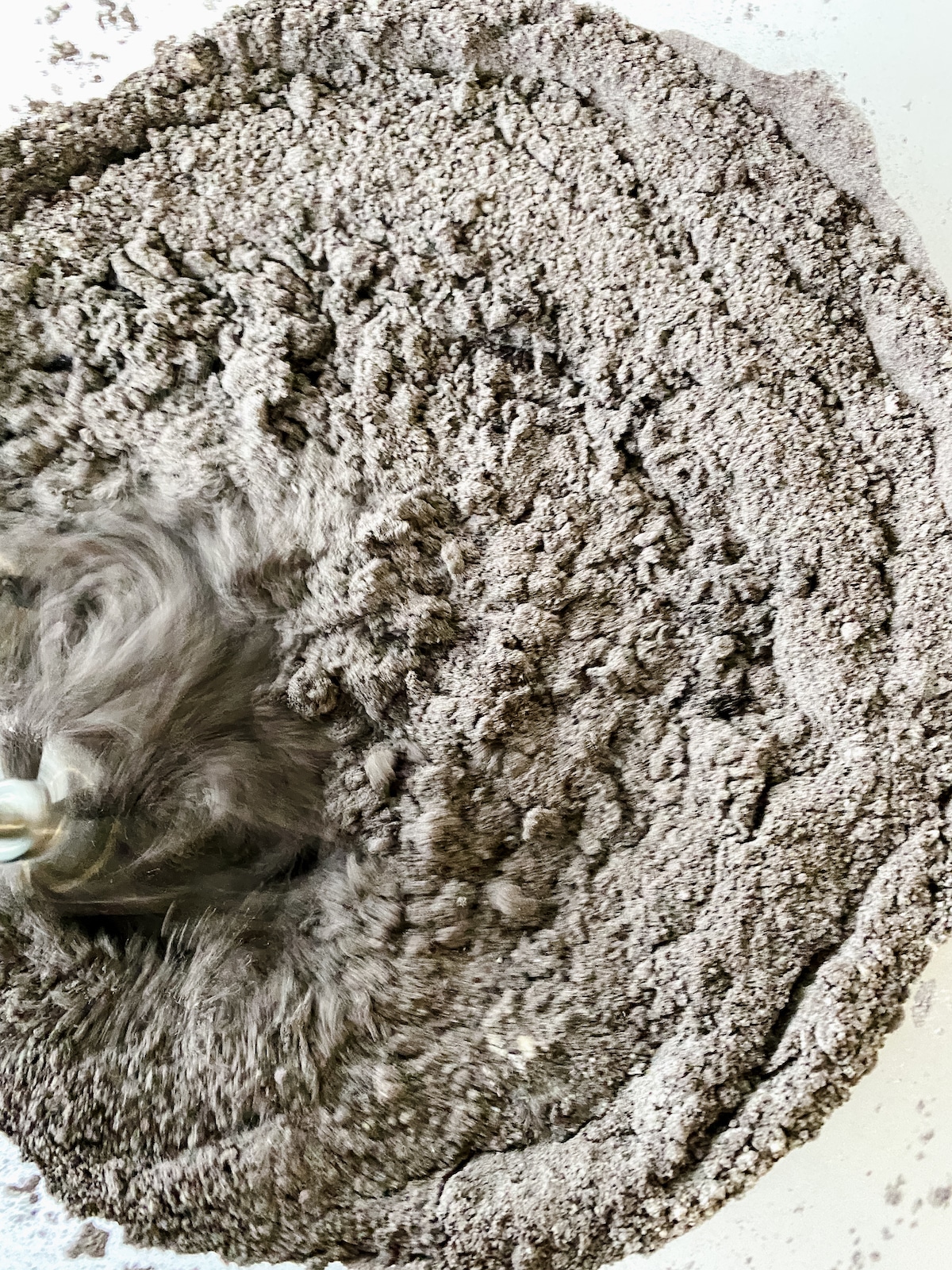 Mixing brownie batter into bowl