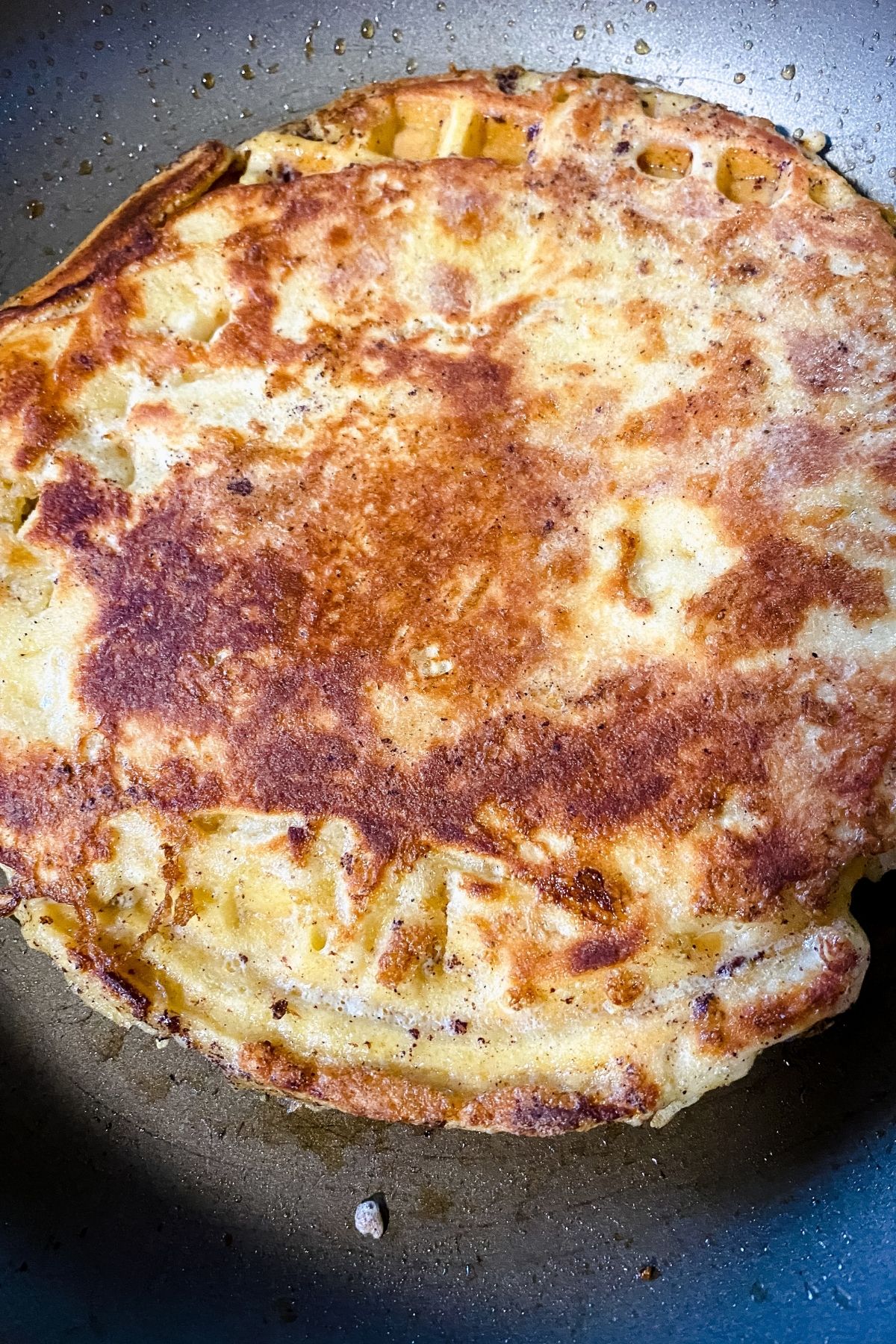 waffle pancake cooking in skillet