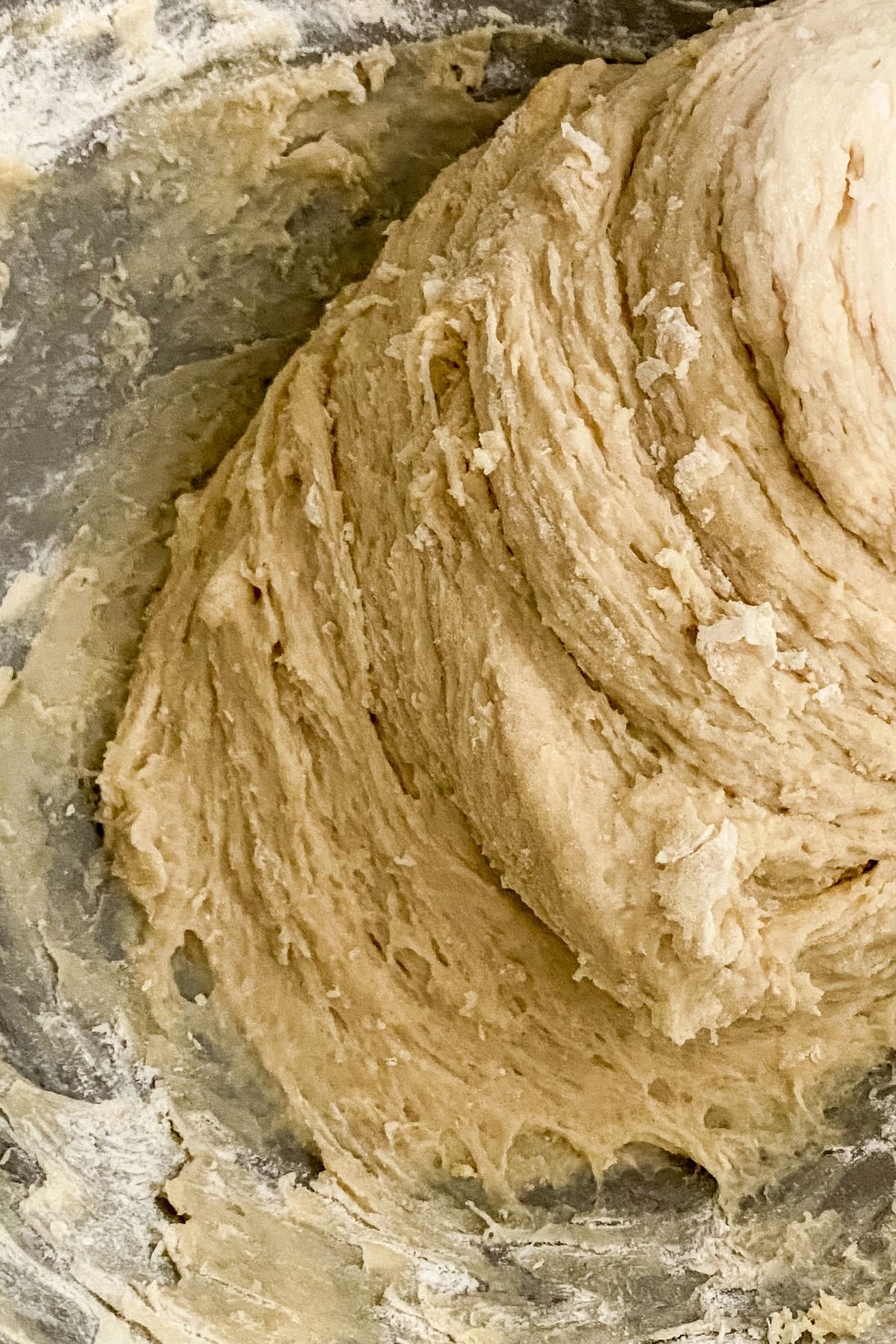 stainless steel bowl of dough