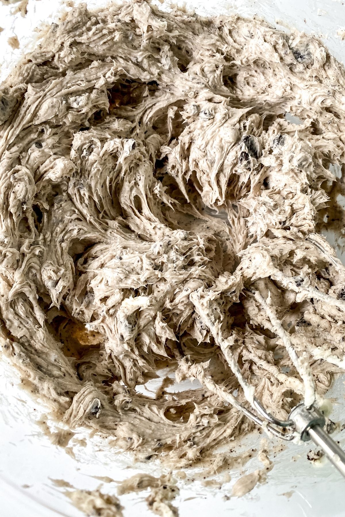 bowl of creamy mixture with beaters