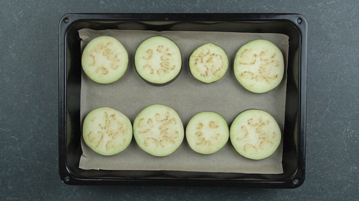 sliced eggplant on a baking sheet