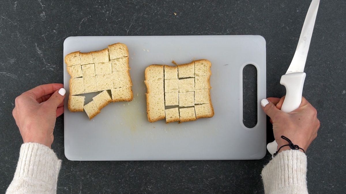 bread sliced on white cutting board