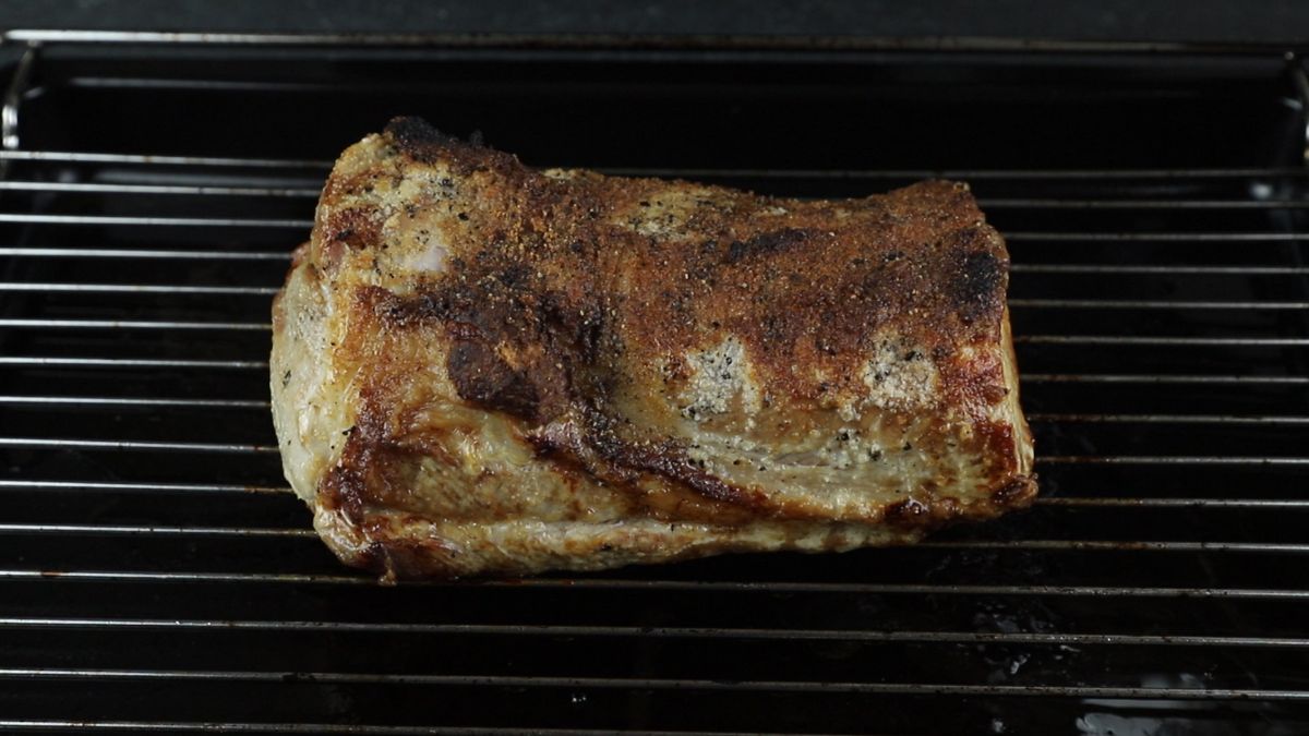 baked pork loin on roasting pan rack
