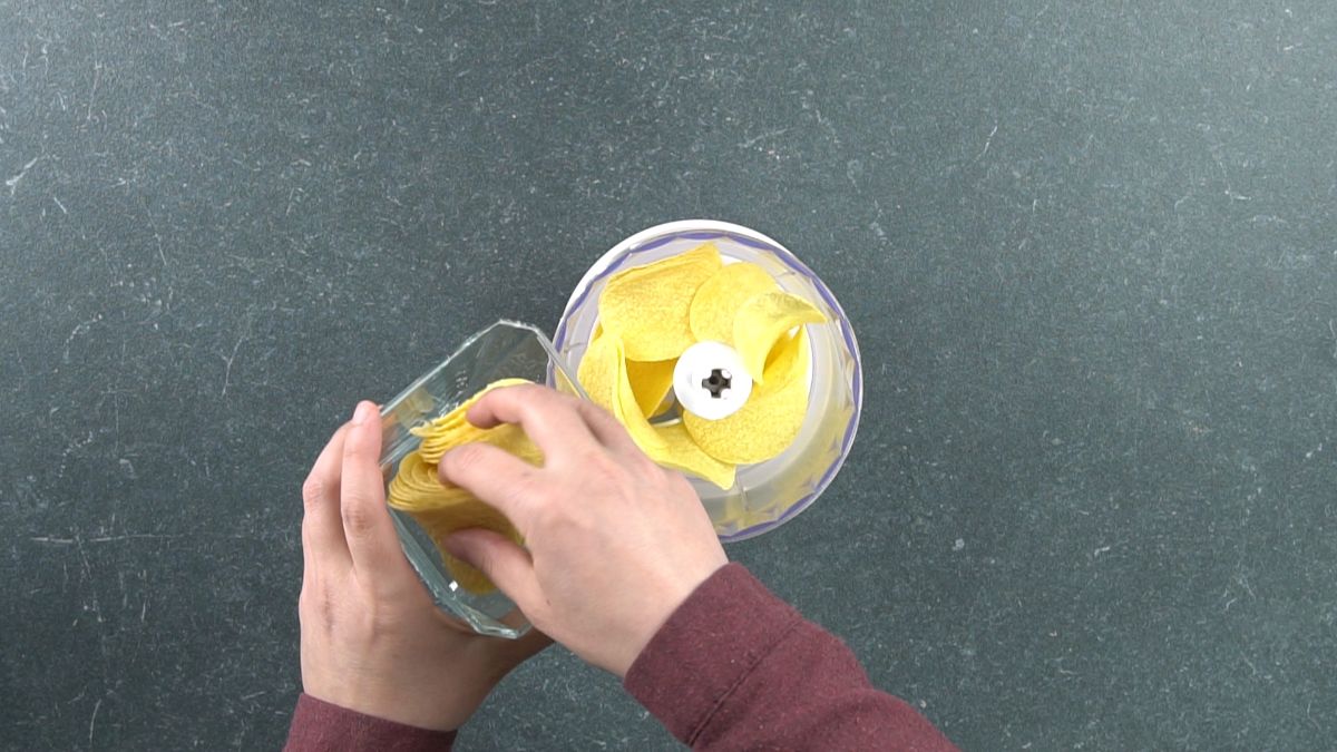 pringles chips being put into a food processor