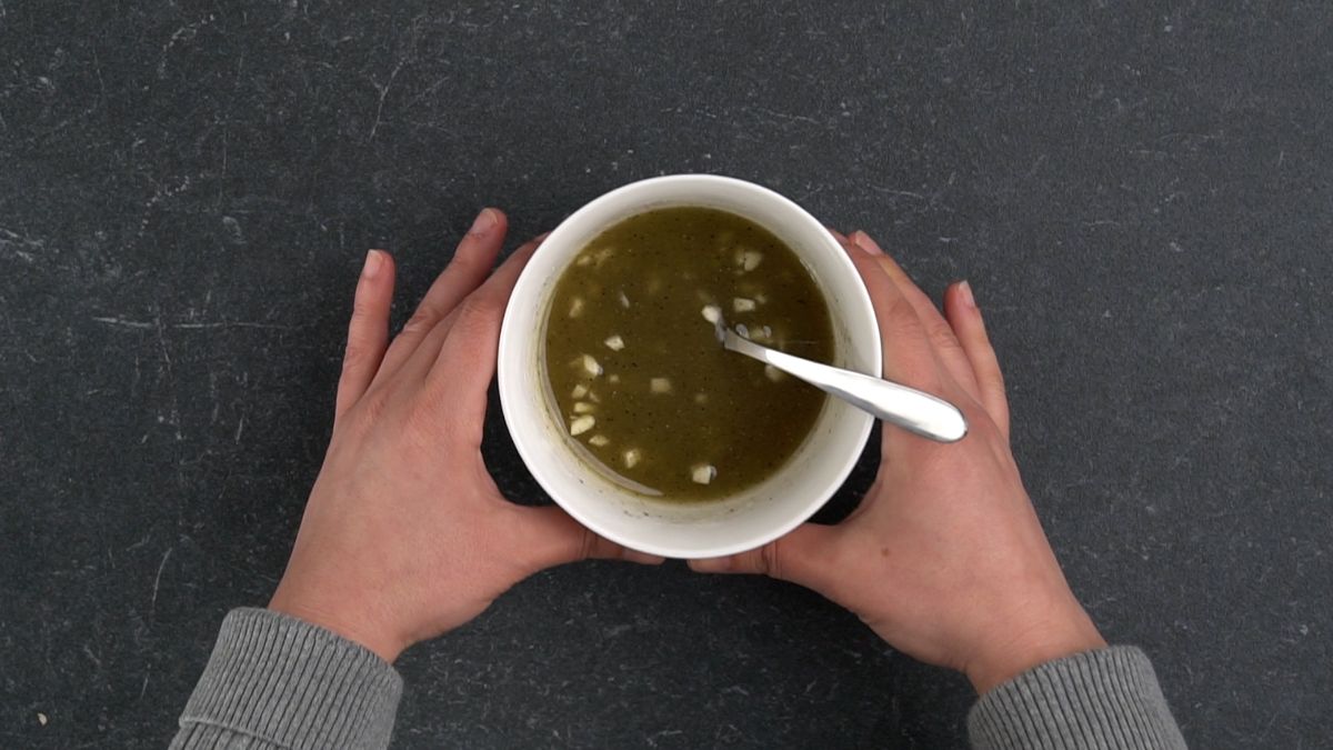vinaigrette in white bowl with spoon