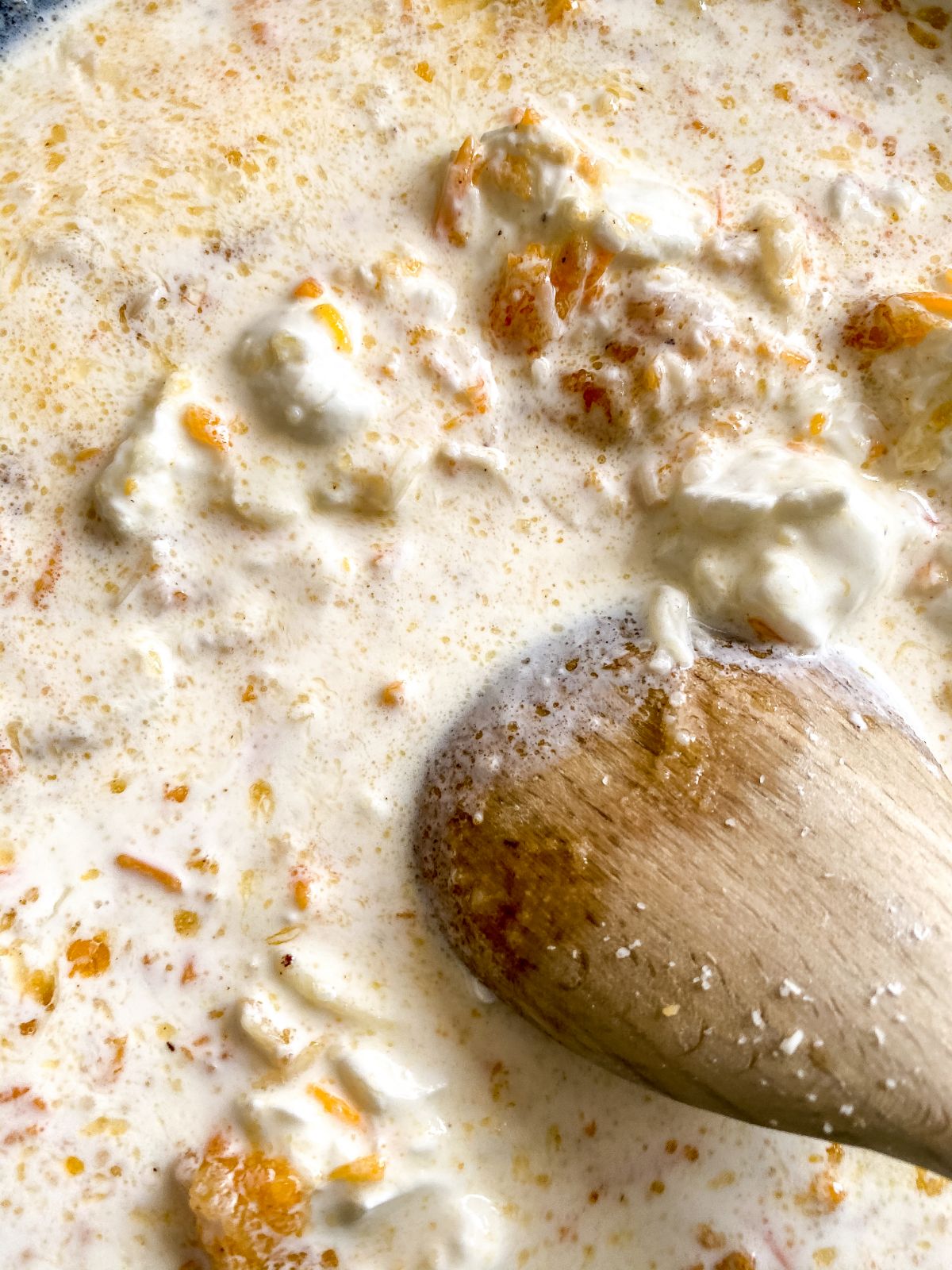 wooden spoon in roux in skillet