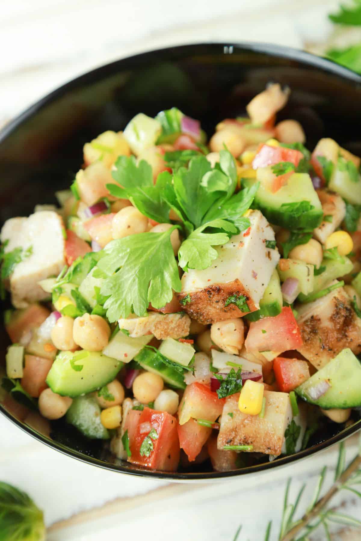 large black bowl of Mediterranean chicken chickpea salad