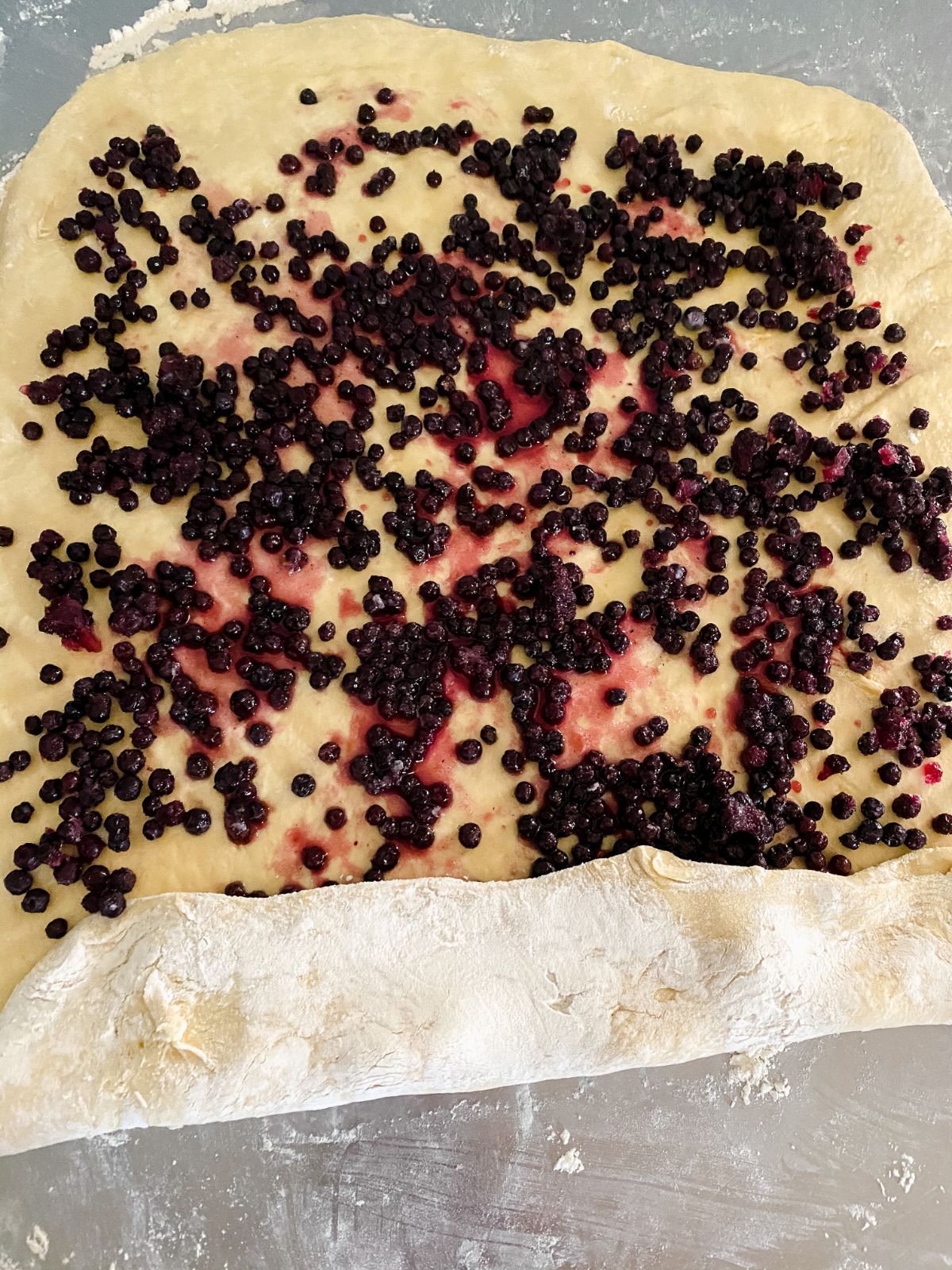 blueberry lemon rolls being rolled