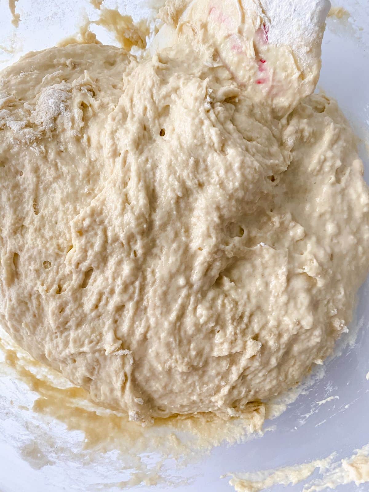 sticky dough in large glass bowl
