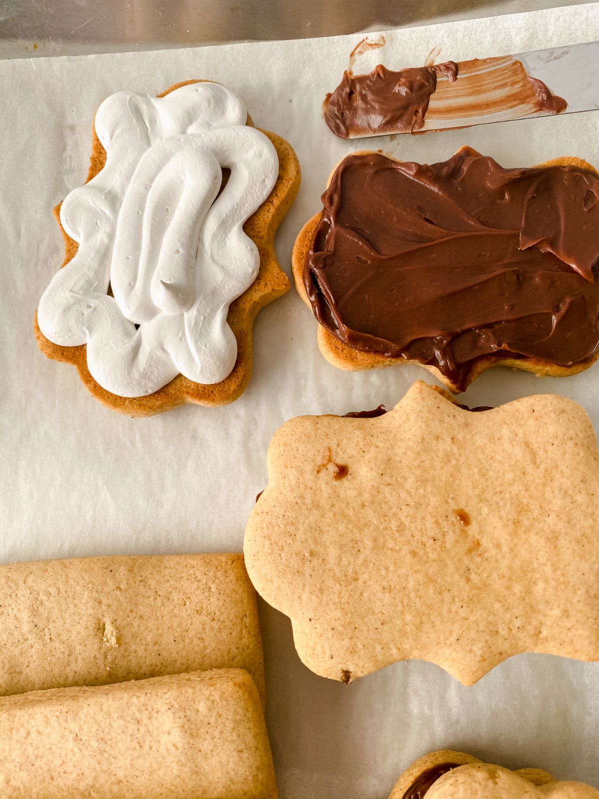 marshmallow on one cookie and chocolate on the other before combining